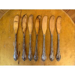 Oneida Rogers 1881 Ltd Enchantment  Lot Of 7 butter knives (7242)